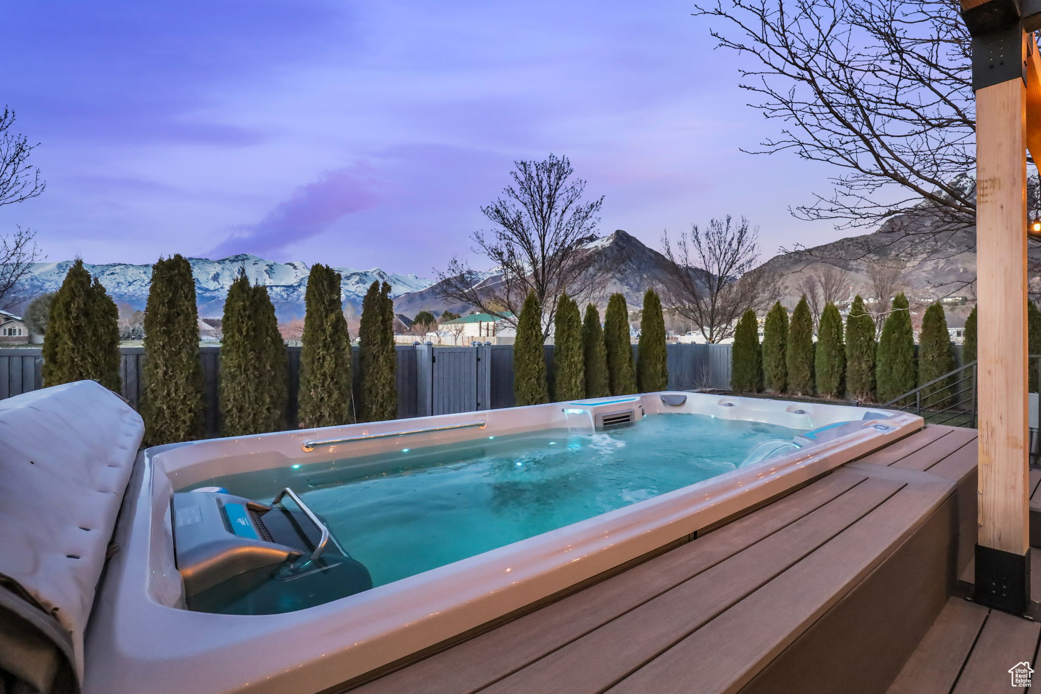 View of pool featuring an outdoor hot tub and a mountain view
