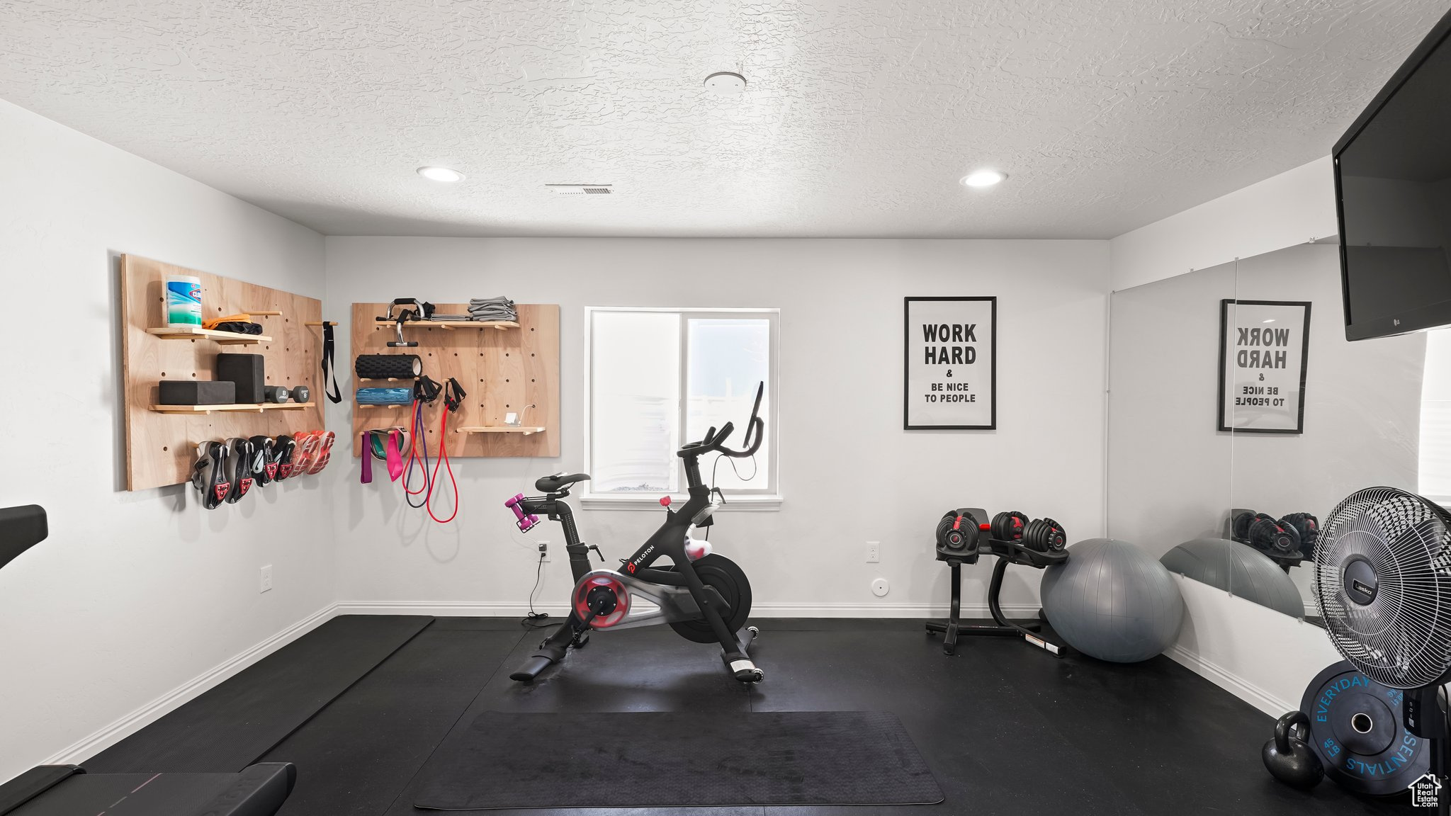 Workout area featuring a textured ceiling