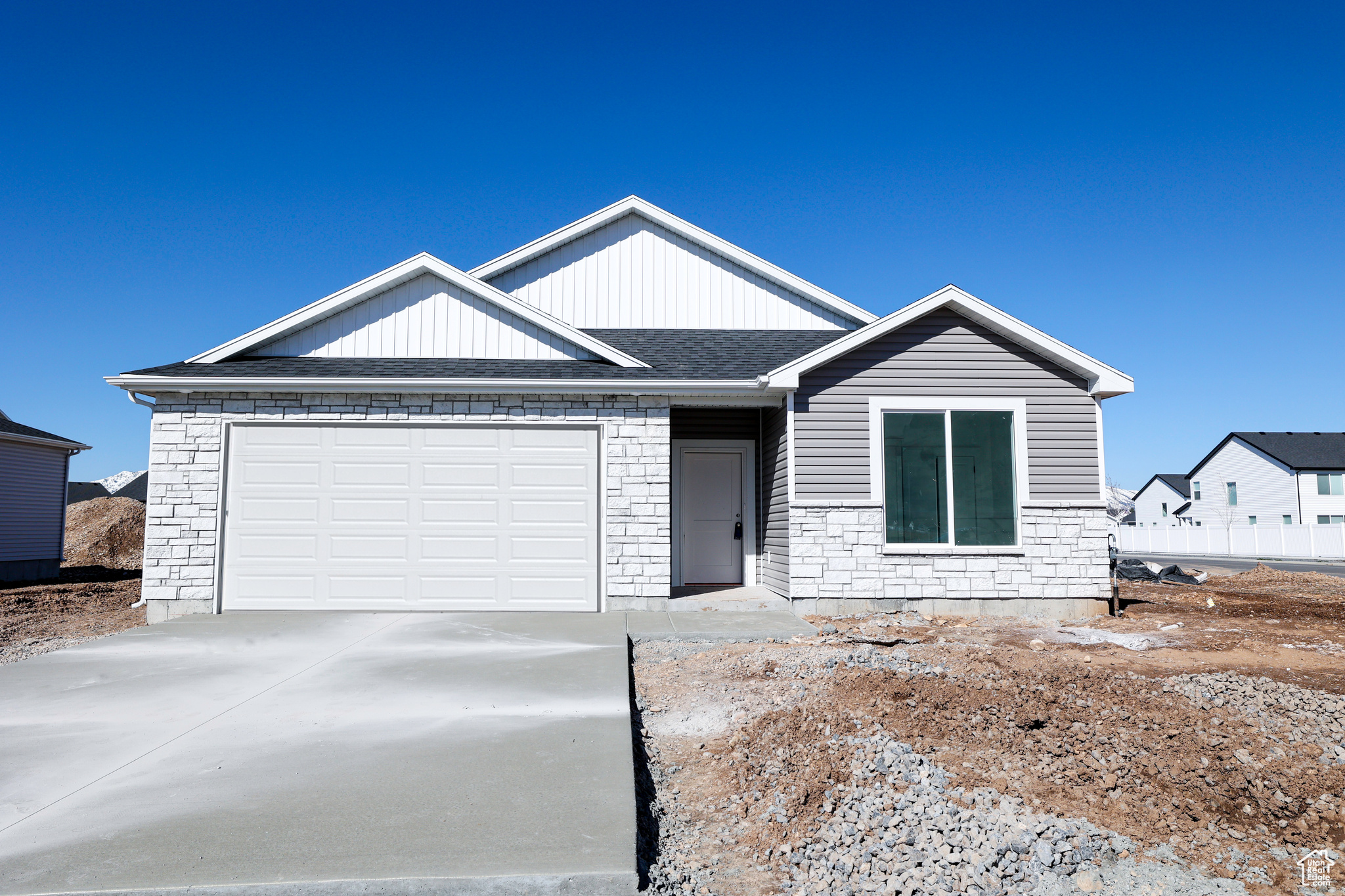 View of front of property featuring a garage