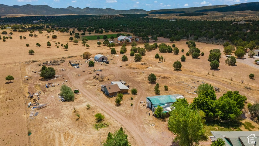 Birds eye view of property featuring a mountain view