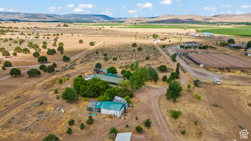 Birds eye view of property featuring a mountain view and a rural view