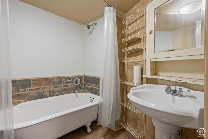 Bathroom with tile patterned flooring