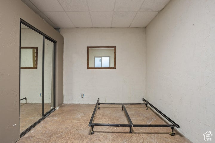 Spare room featuring a drop ceiling