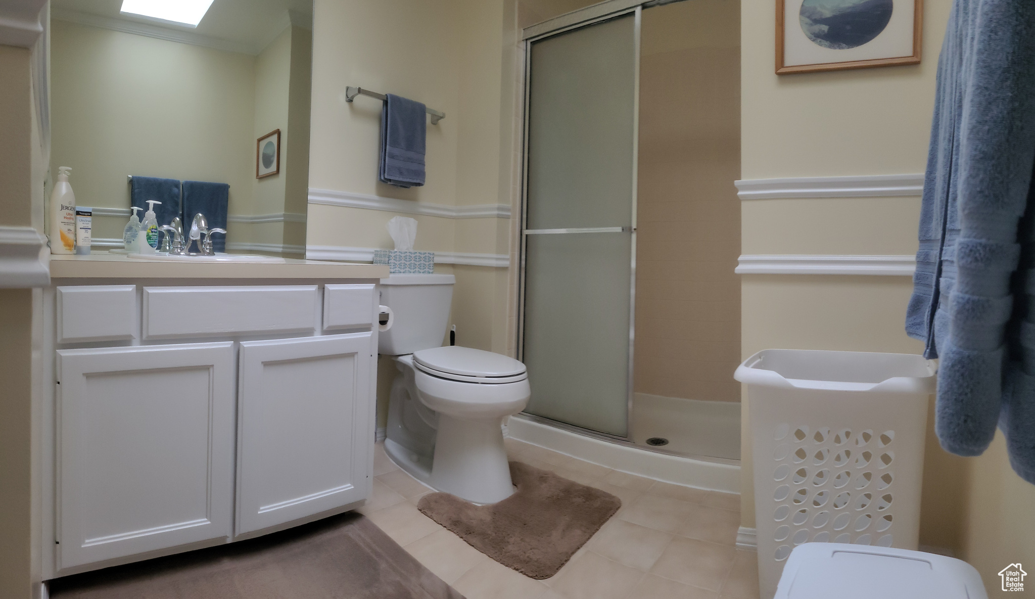1st Bathroom is the Primary Bedroom on Suite,  with a large walk in shower, toilet, vanity, and laminate wood flooring