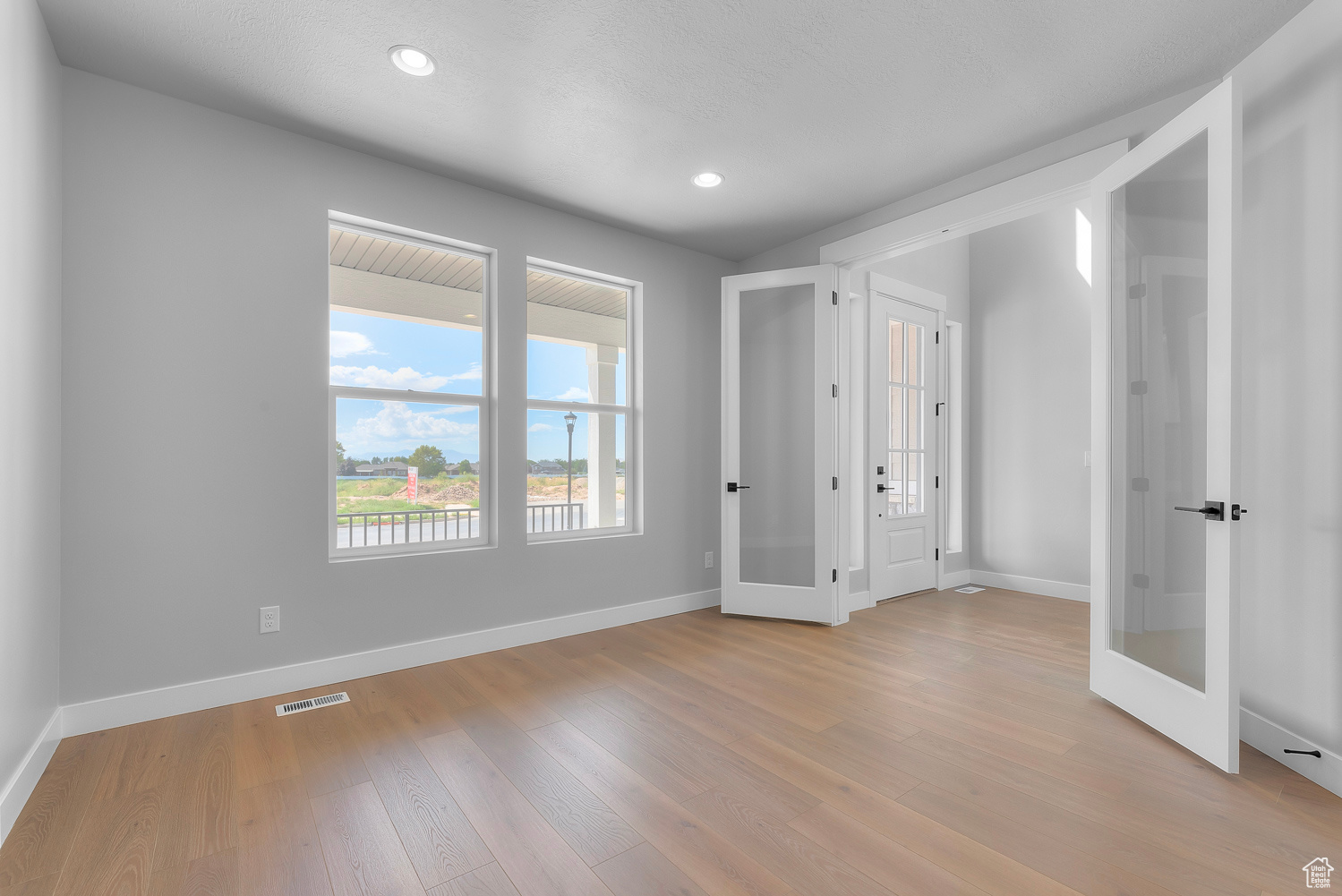 Unfurnished bedroom featuring light wood-type flooring