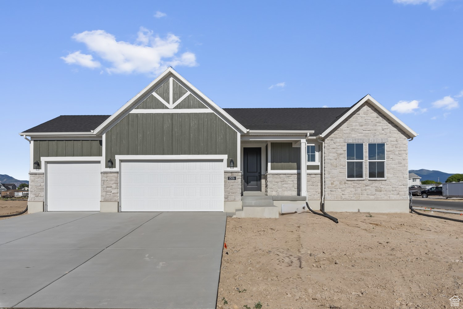 View of front of property featuring a garage