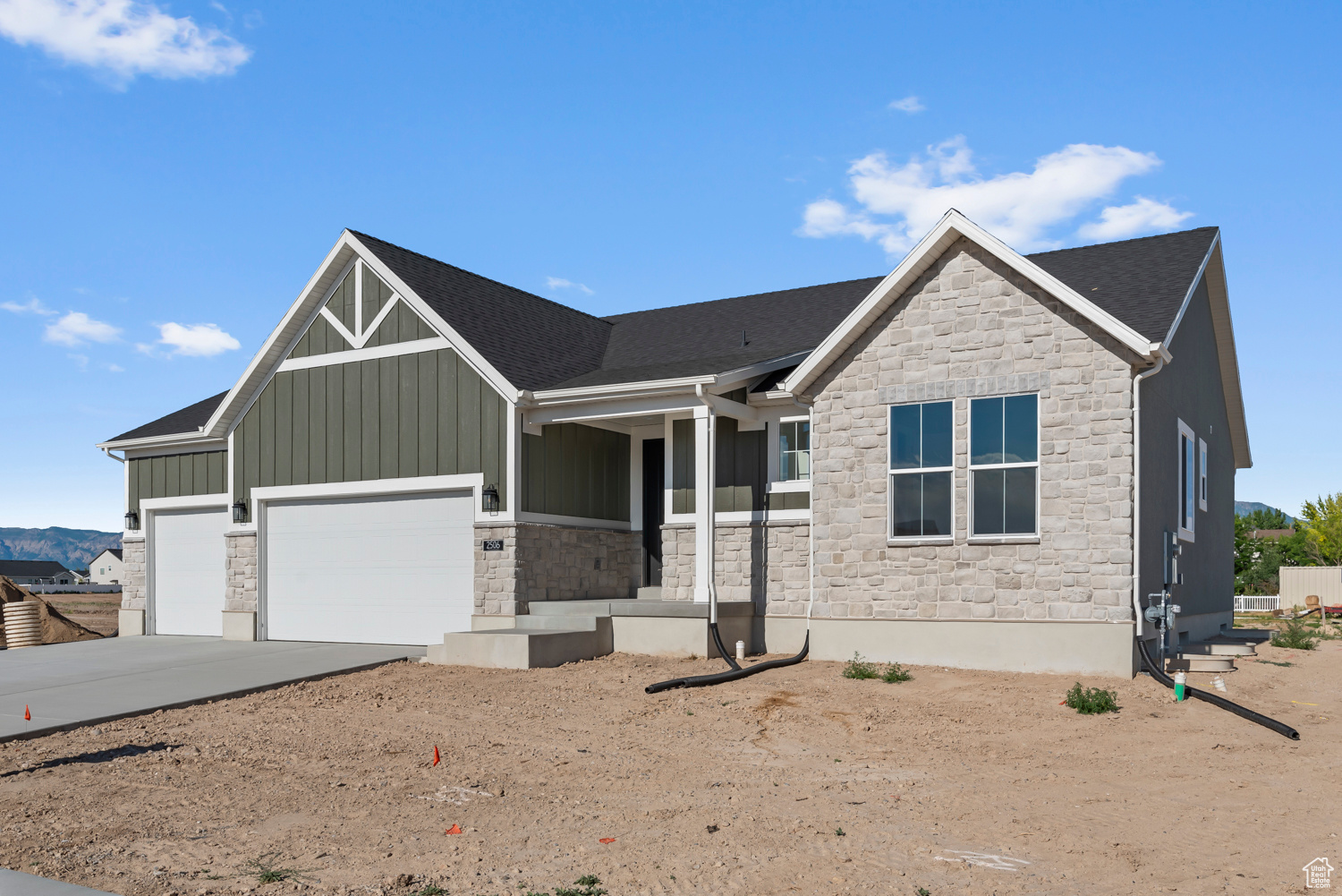 View of front facade featuring a garage