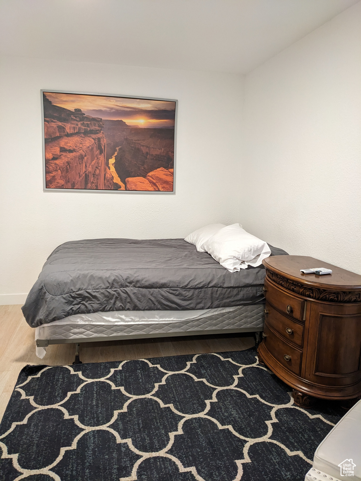 Bedroom featuring dark wood-style flooring