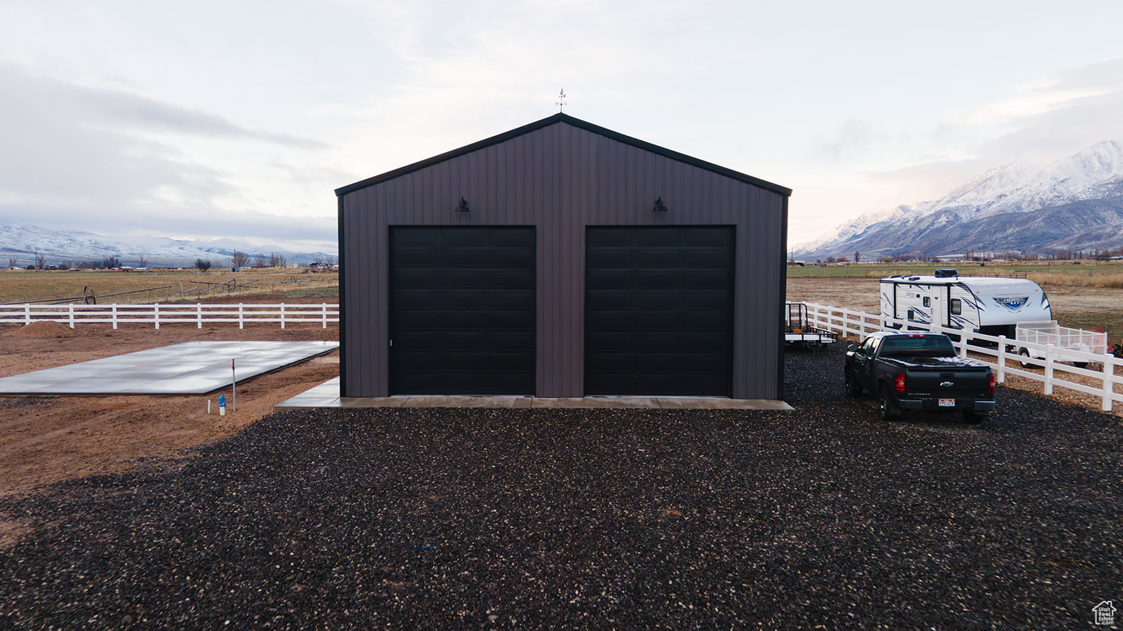 Garage featuring a mountain view and a rural view