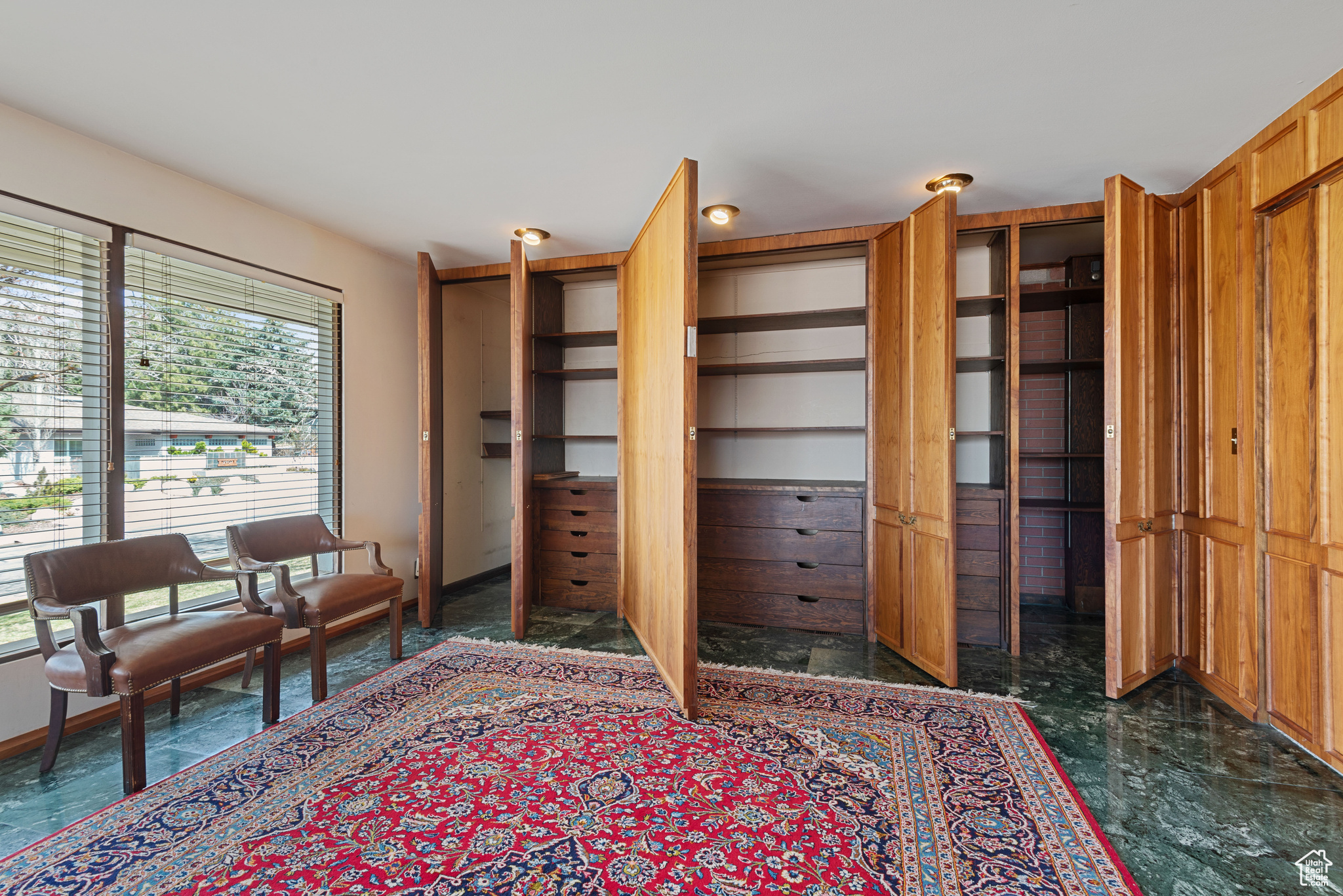 Office/Library View of Hidden Panelled bookshelves and drawers.