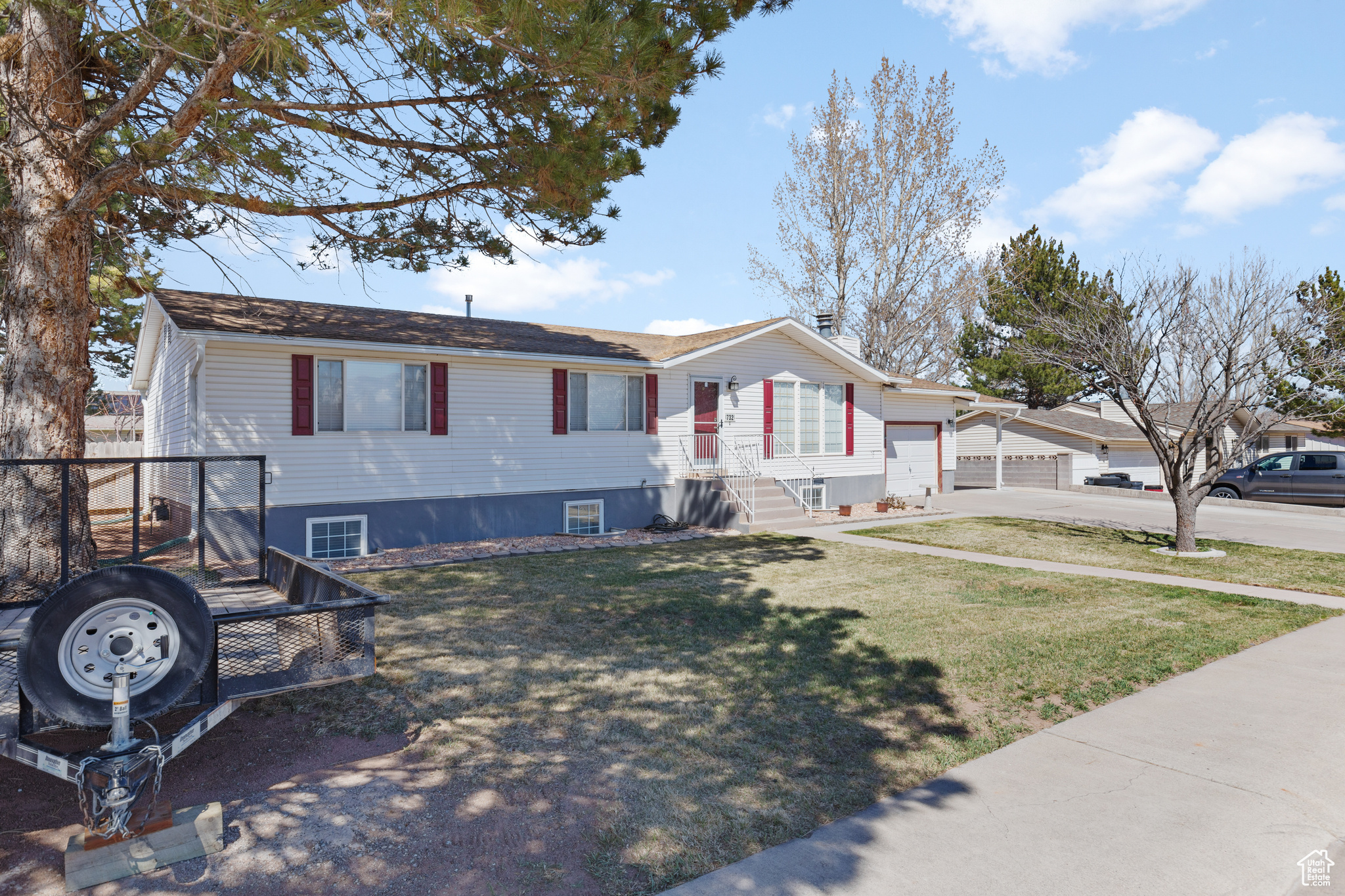 Split foyer home with a front lawn