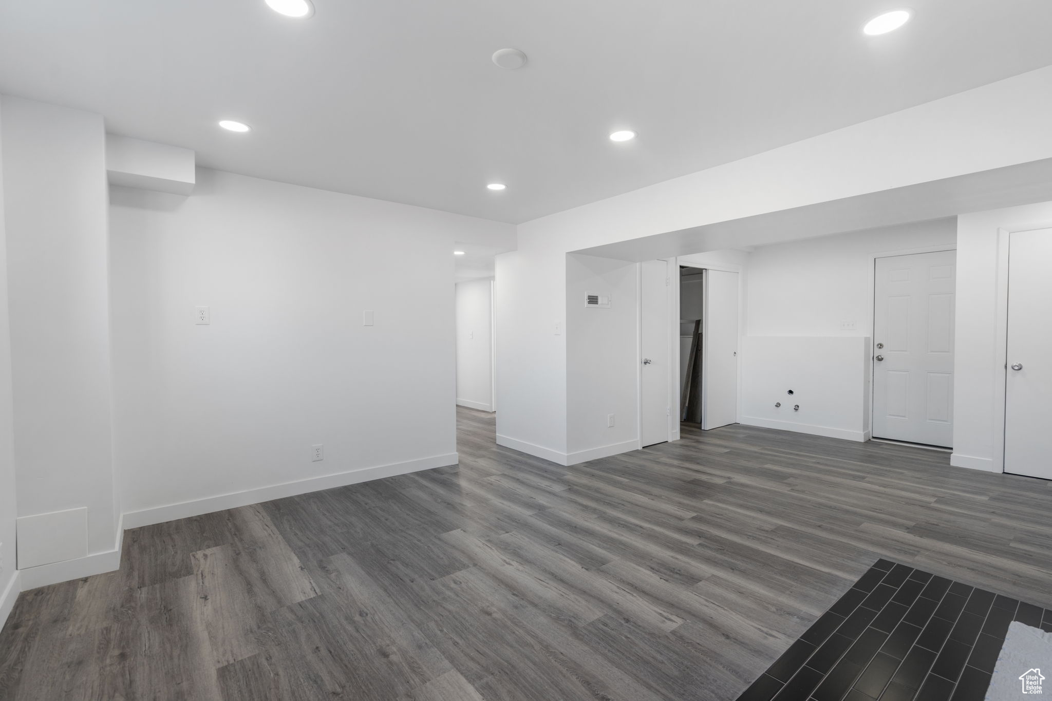 Basement featuring dark hardwood / wood-style floors