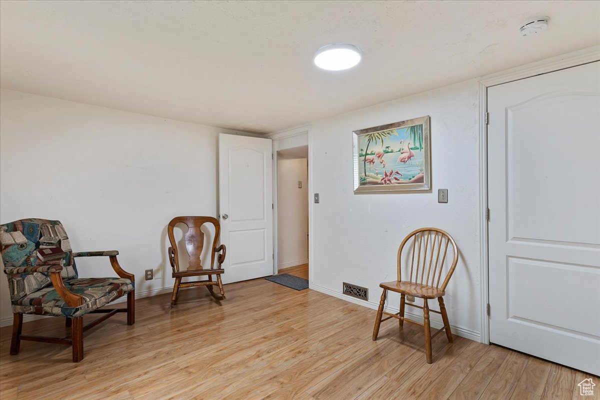 Living area featuring light hardwood / wood-style floors