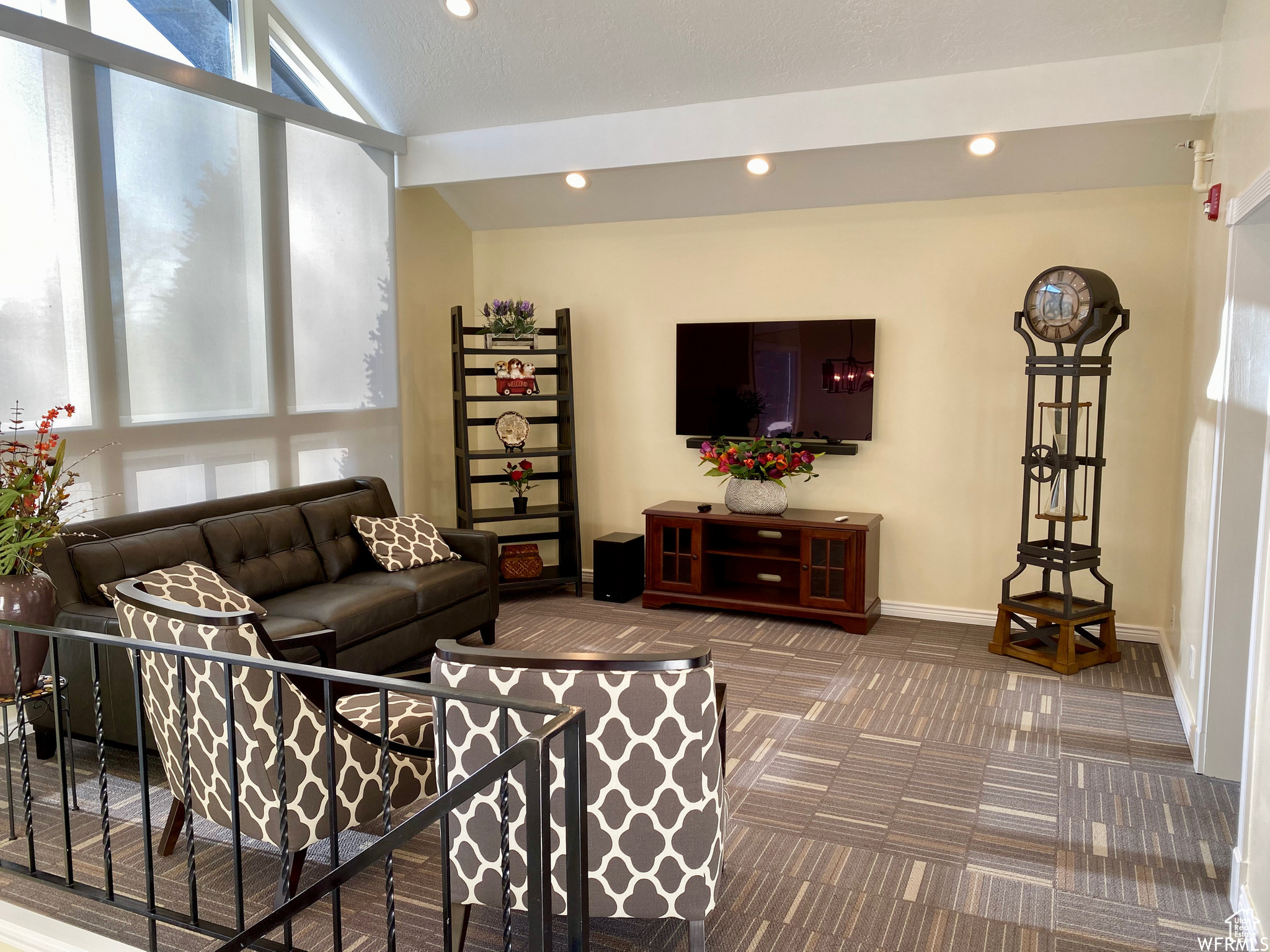 Living room featuring vaulted ceiling