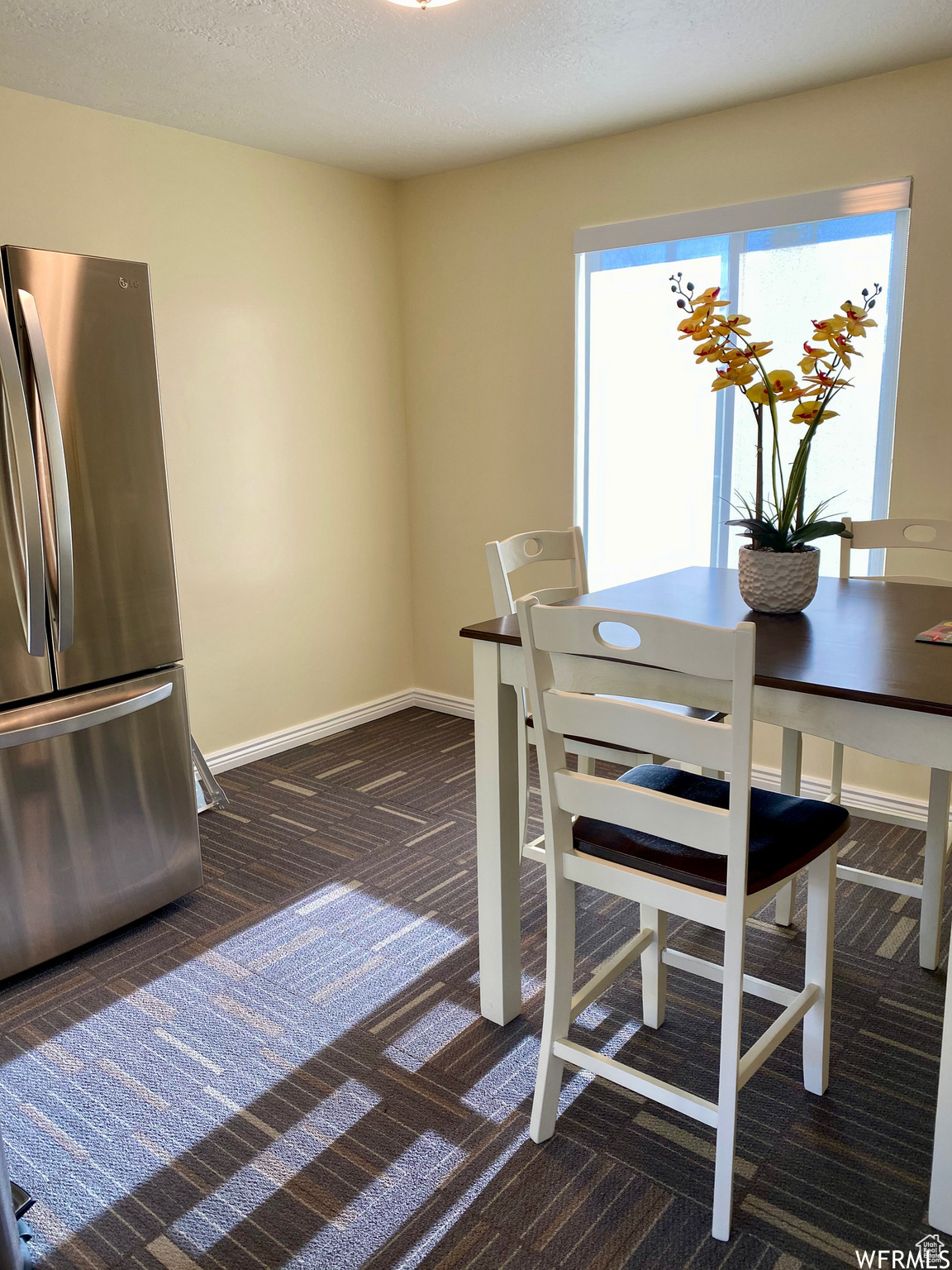 Dining room featuring a textured ceiling