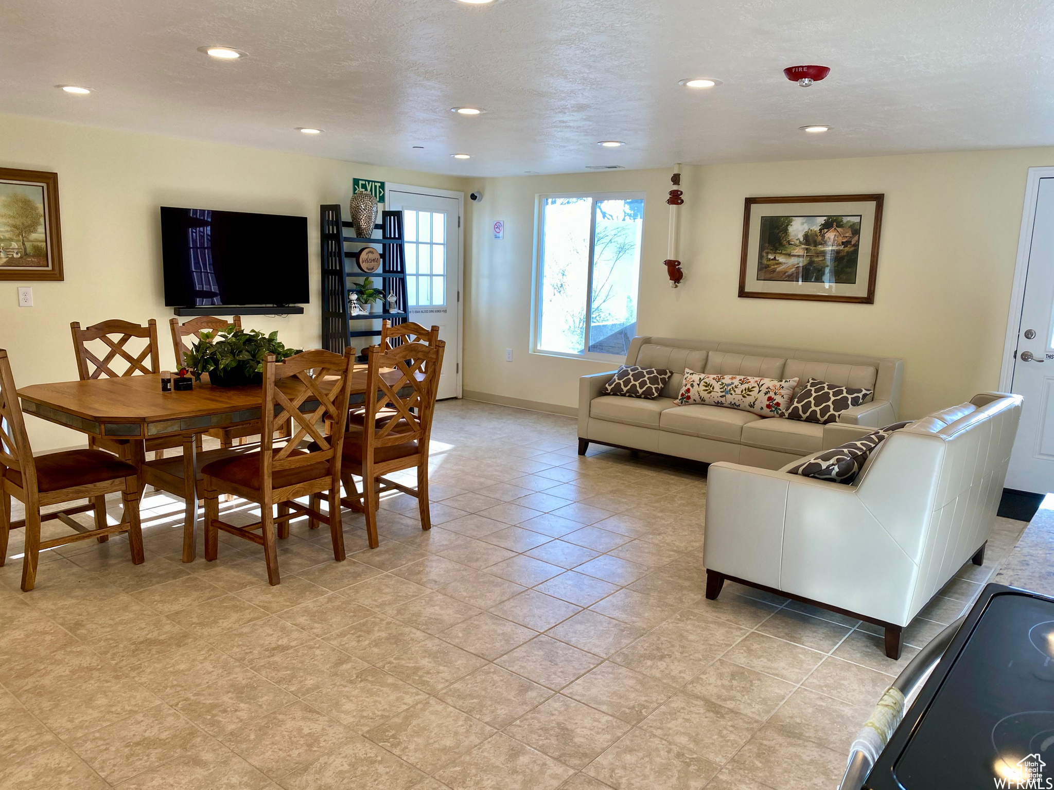 Interior space featuring light tile floors