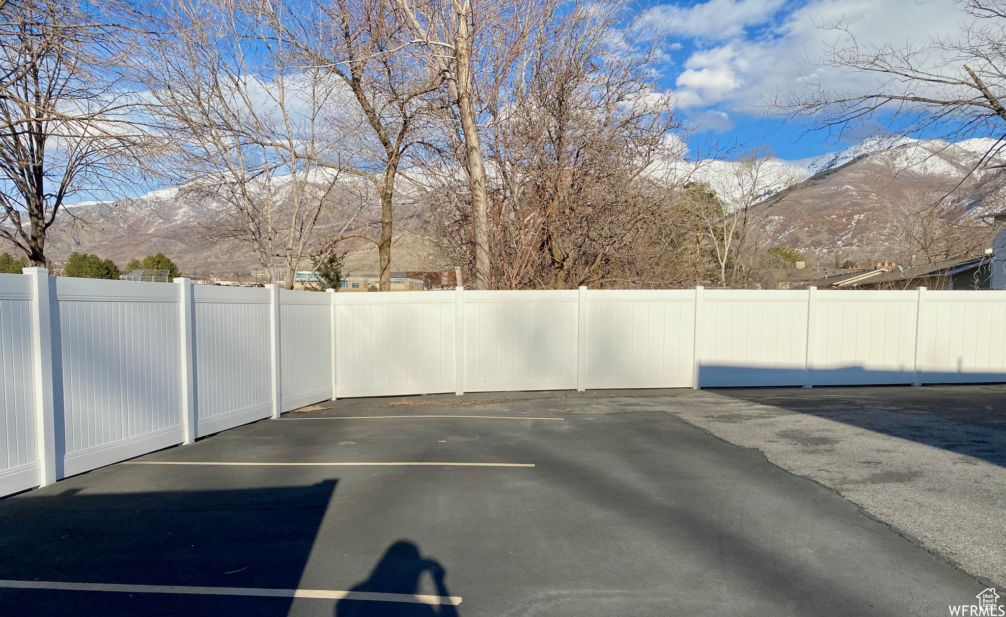 View of parking / parking lot featuring a mountain view