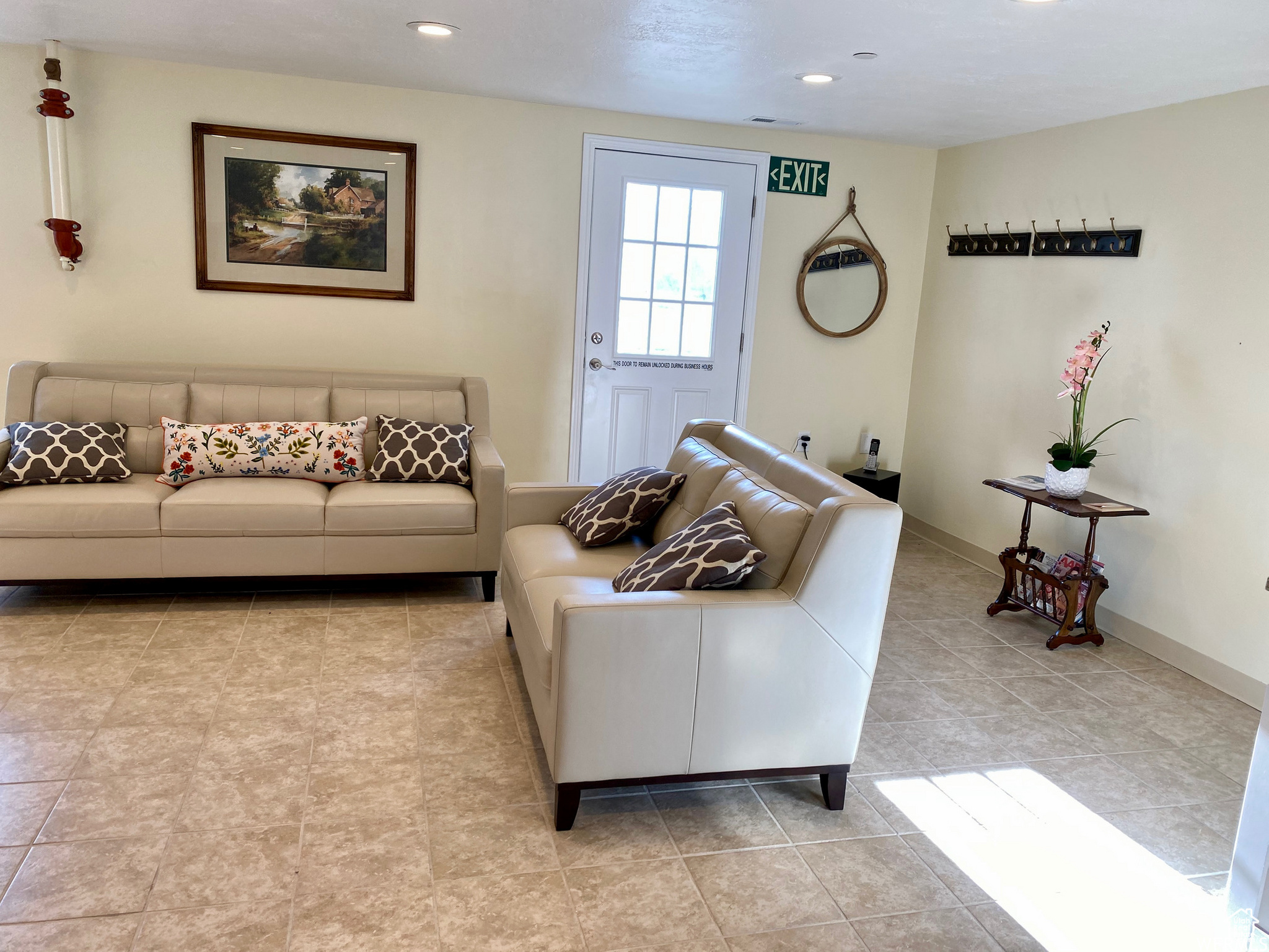 Living room featuring light tile floors