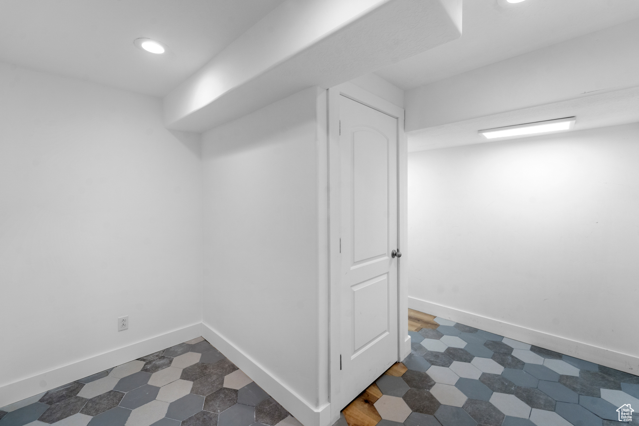 Basement featuring dark tile floors