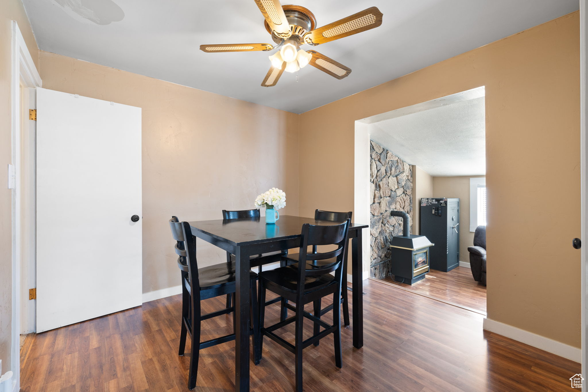 Dining area featuring dark hardwood / wood-style floors and ceiling fan