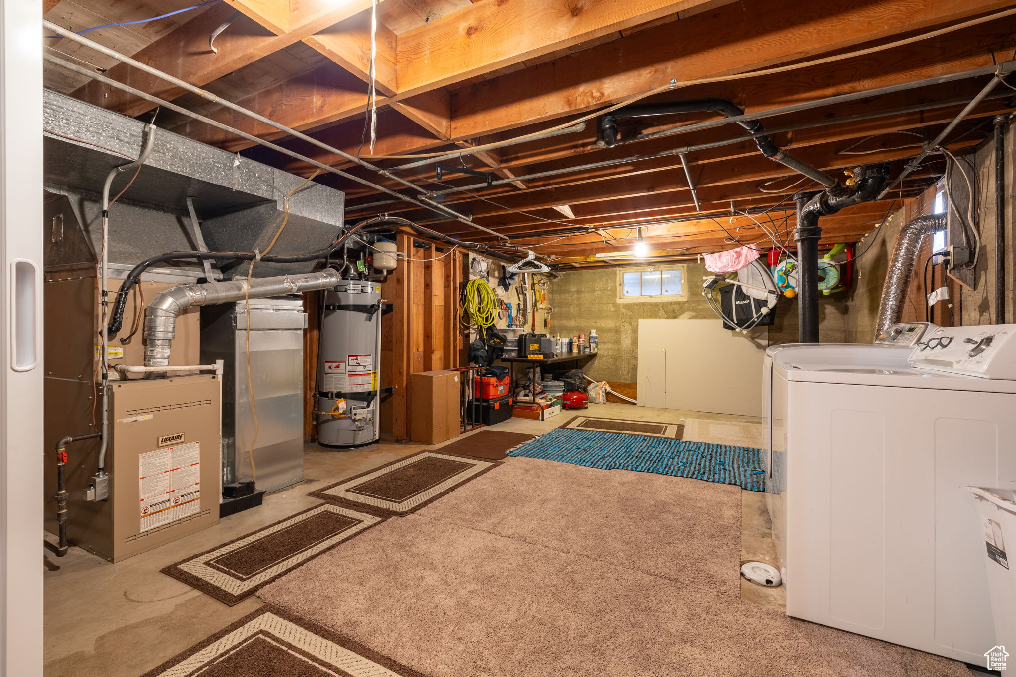 Basement with separate washer and dryer and secured water heater