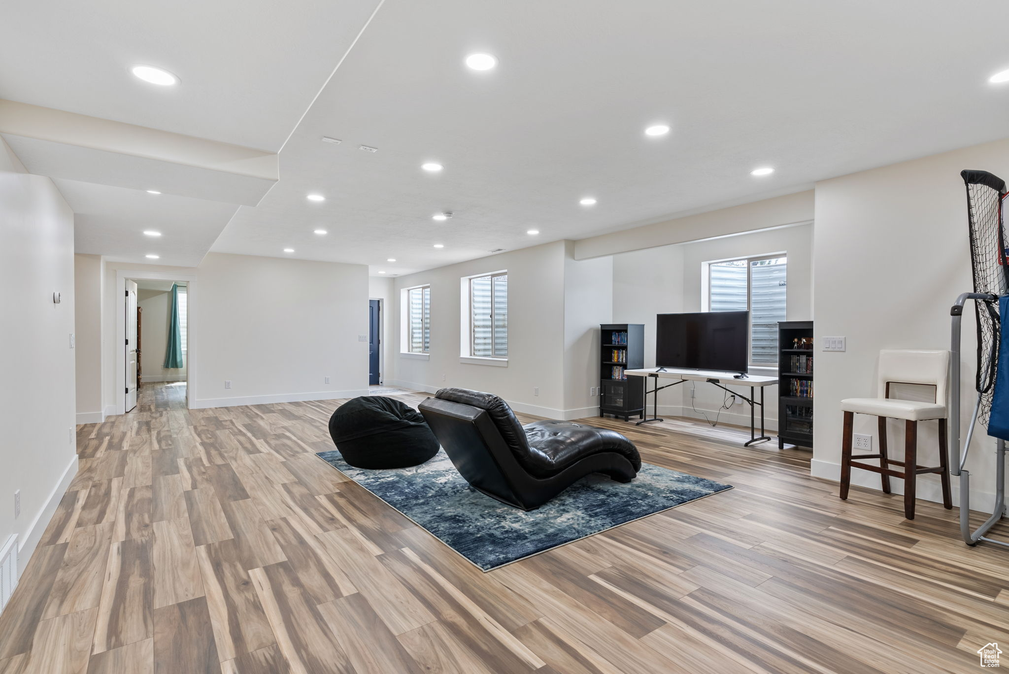 Family Room with light hardwood / wood-style floors