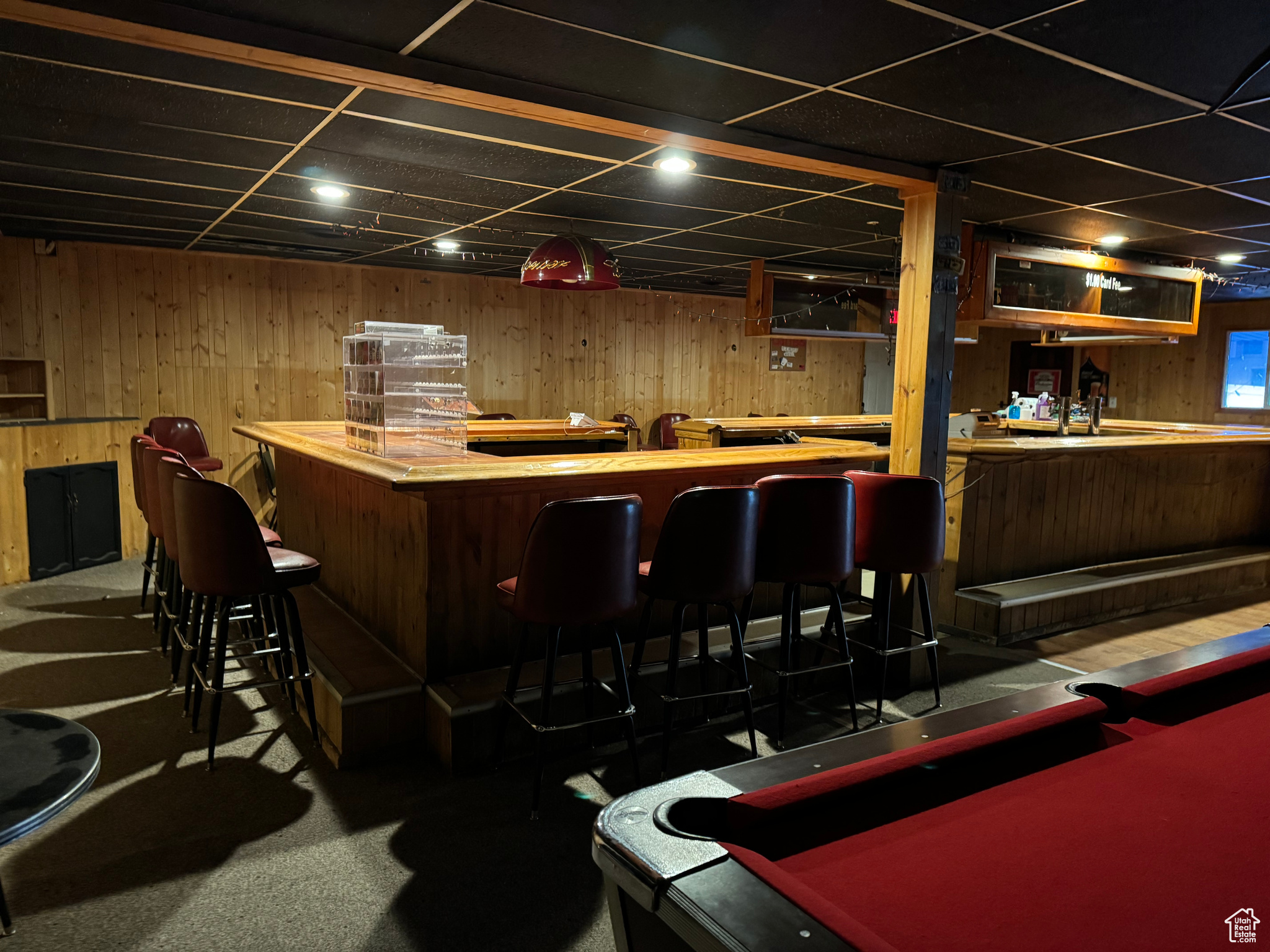 Bar with a paneled ceiling, pool table, and wooden counters