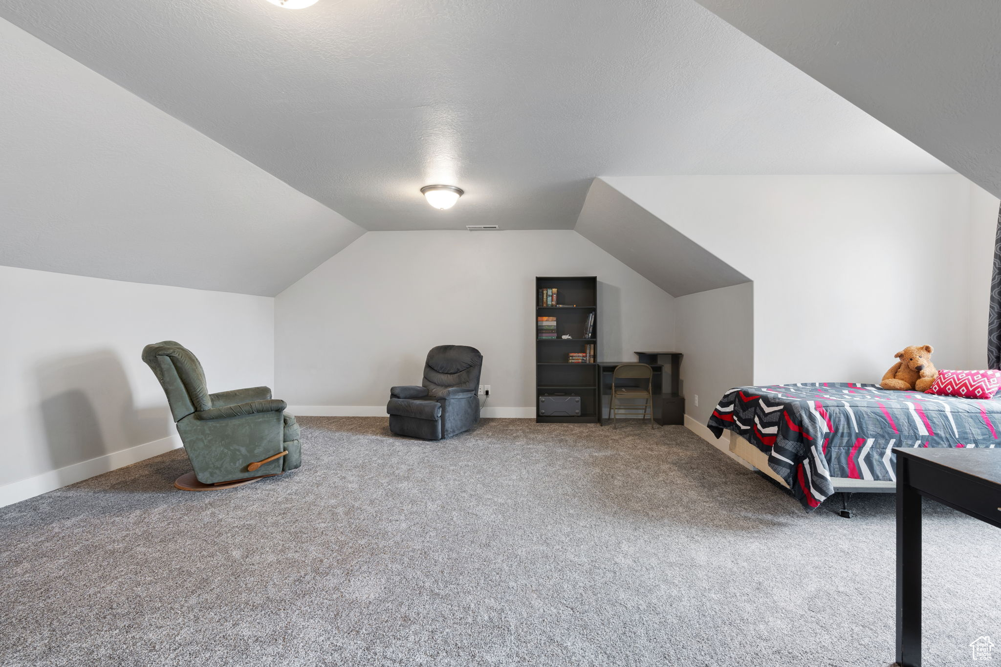 Large bedroom 4 over the garage. Seller has used it for a massive bedroom for multiple kids. Loft style game room, media room, toy room, or family room.