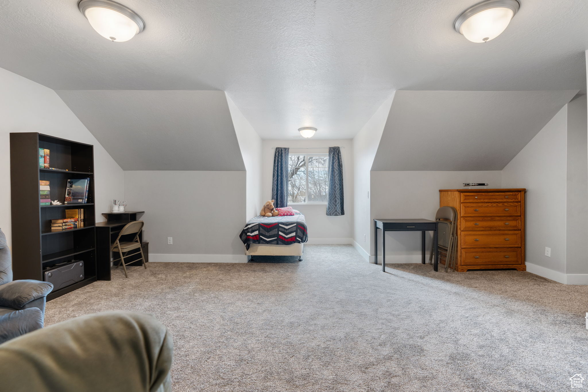 Large bedroom 4 over the garage. Seller has used it for a massive bedroom for multiple kids. Loft style game room, media room, toy room, or family room.