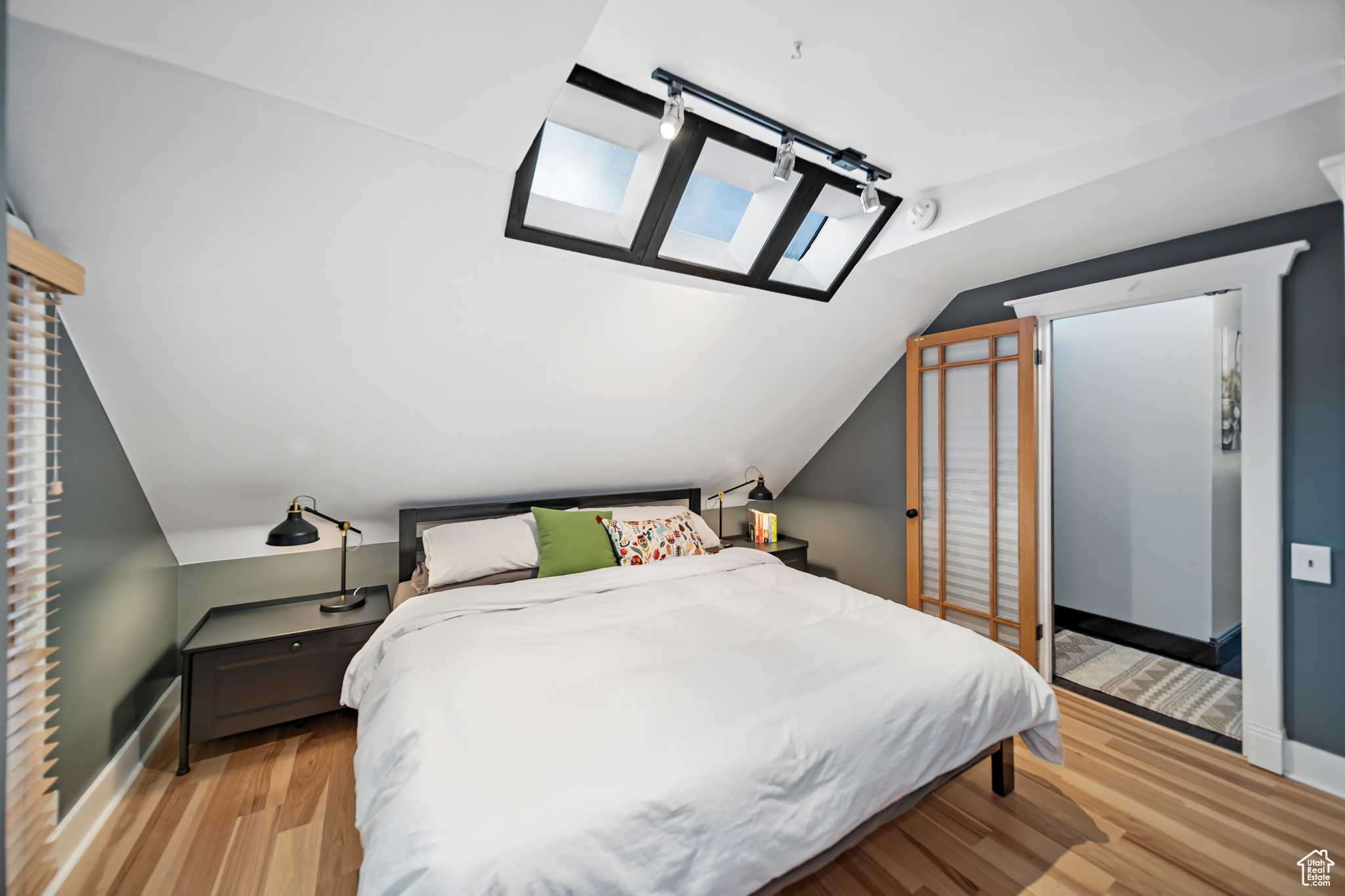 Bedroom 1, Lofted Ceiling w/ Skylights, Track Lighting, Wood Blinds, Wood Floor, Custom Trim