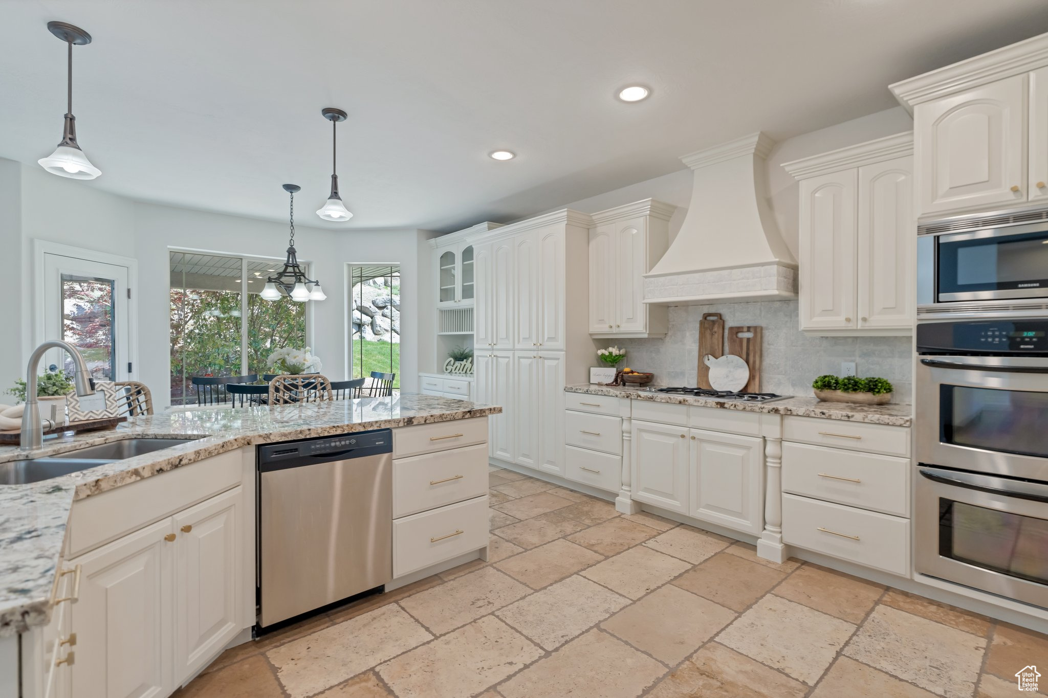 Kitchen features Granite Counters and Double Wall Ovens