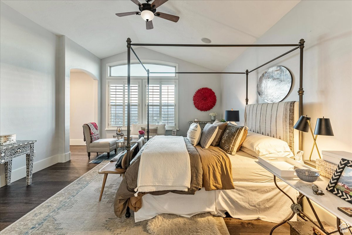 Bedroom featuring lofted ceiling, ceiling fan, and engineered hardwood flooring