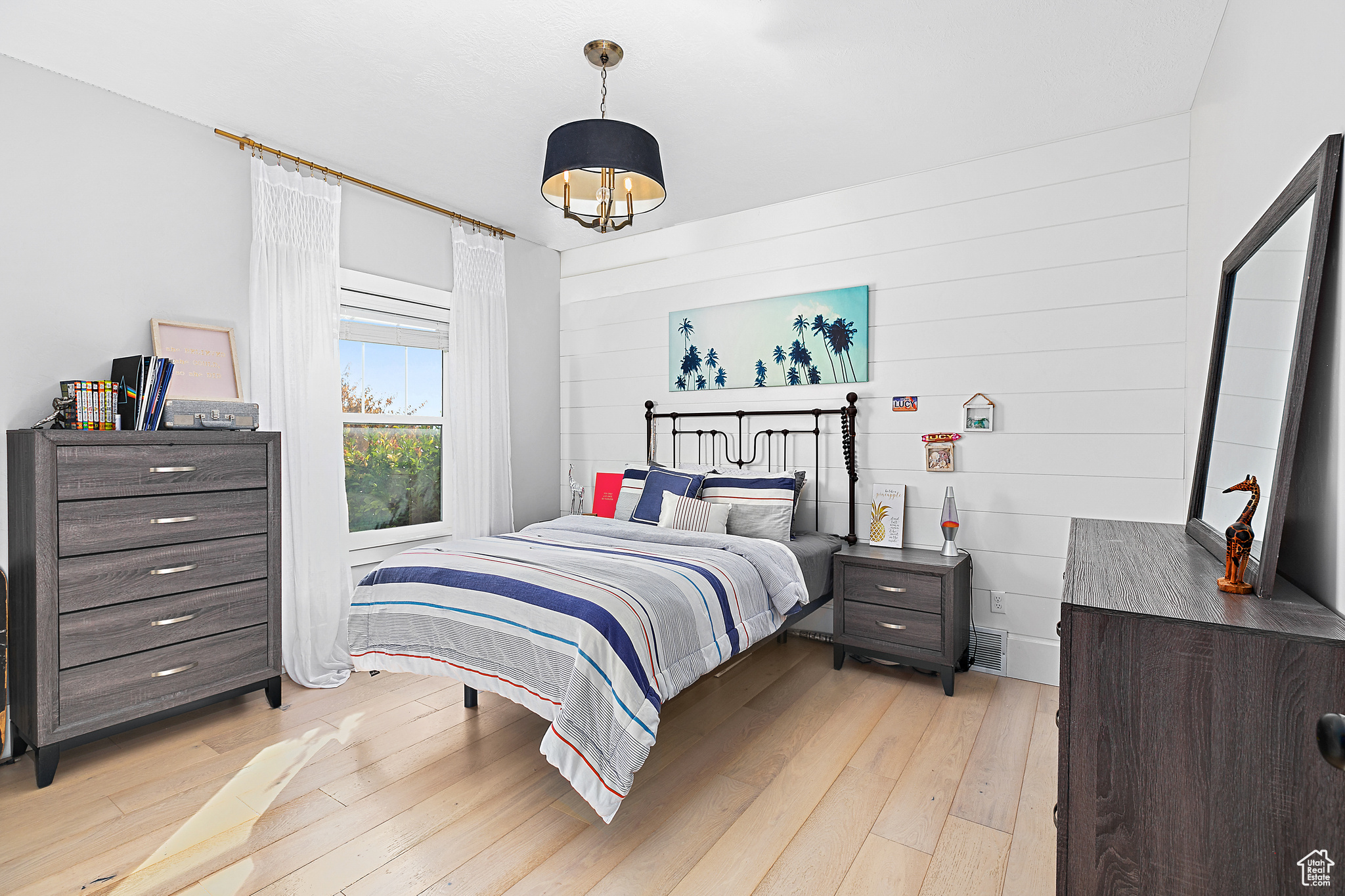 Main Level Bedroom featuring shiplap wall