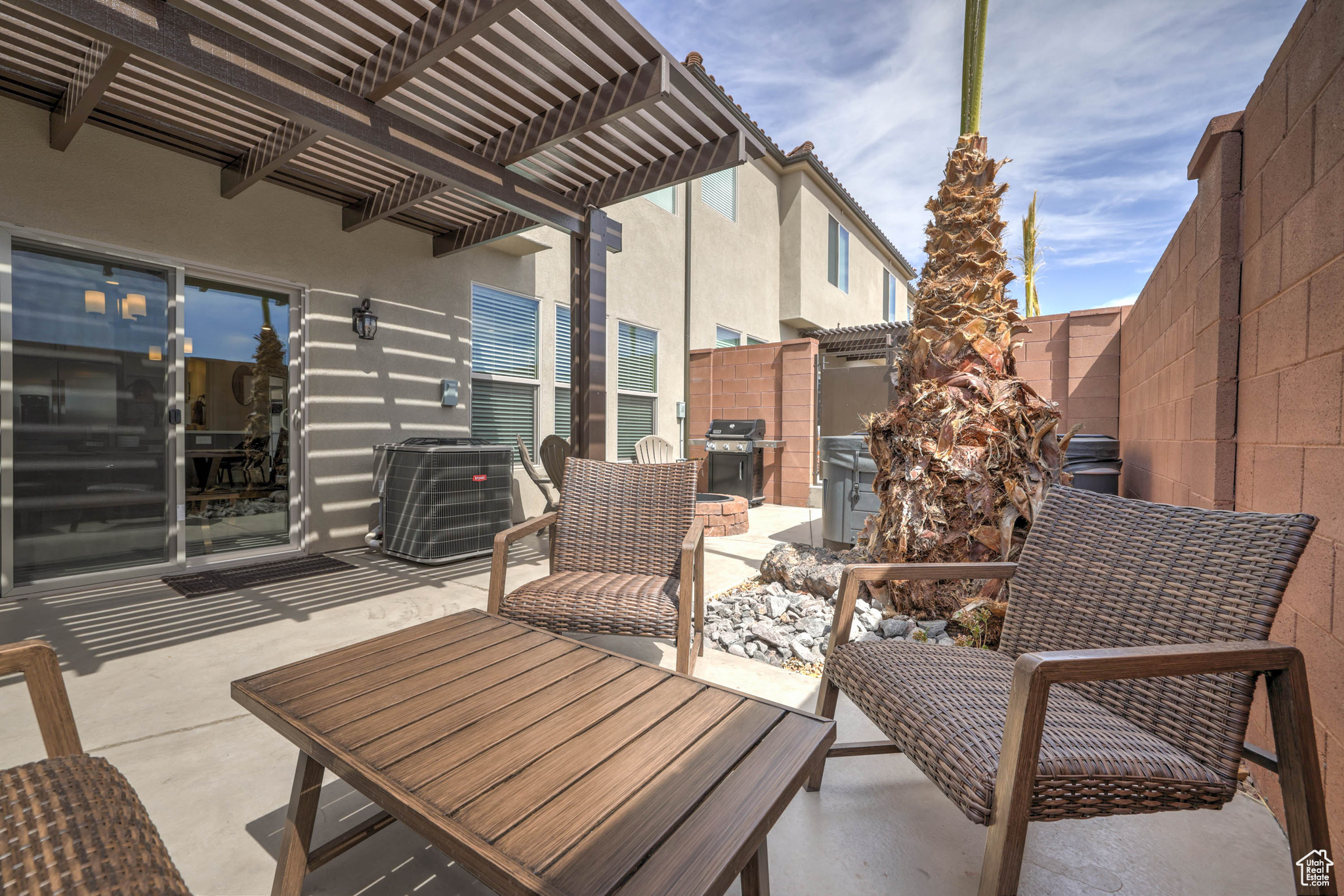 View of patio featuring grilling area, a pergola, and central air condition unit