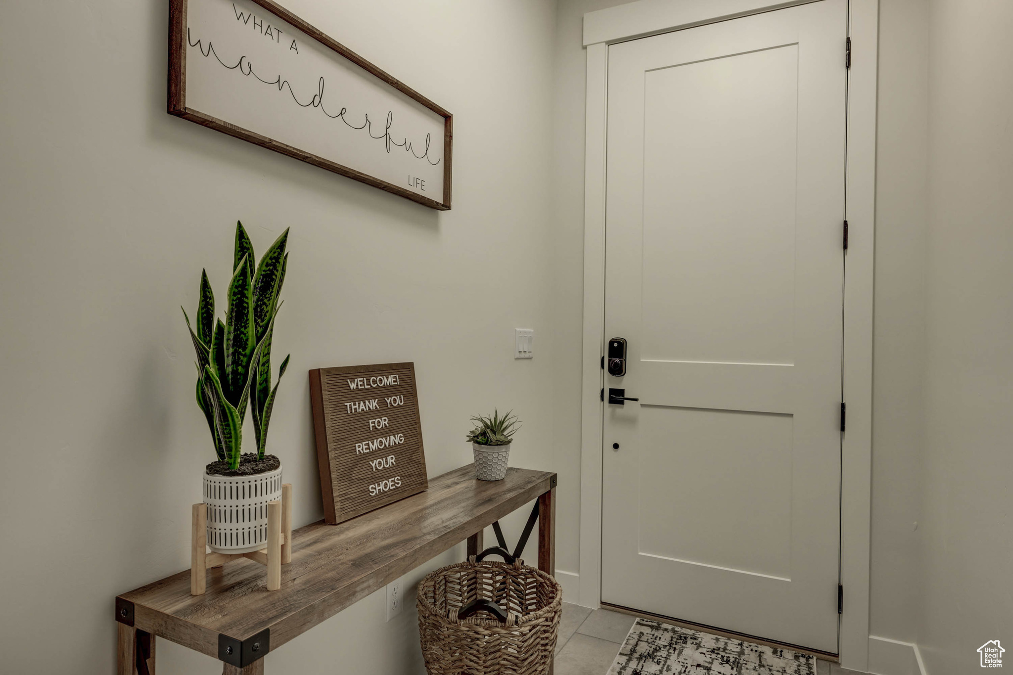 Doorway to outside with light tile floors