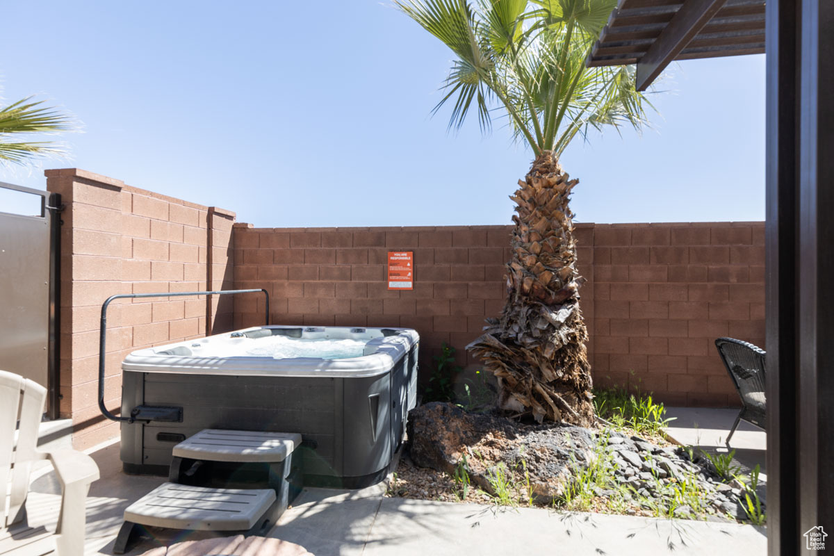 View of patio / terrace with a hot tub