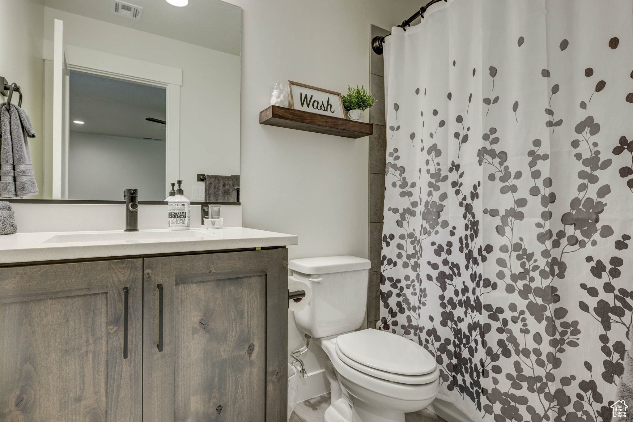 Bathroom featuring toilet and vanity