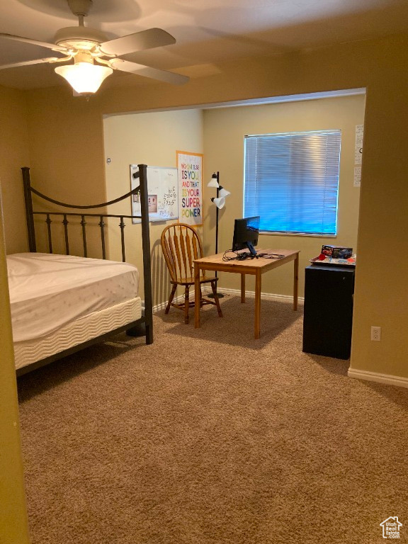 Carpeted 2nd bedroom with ceiling fan