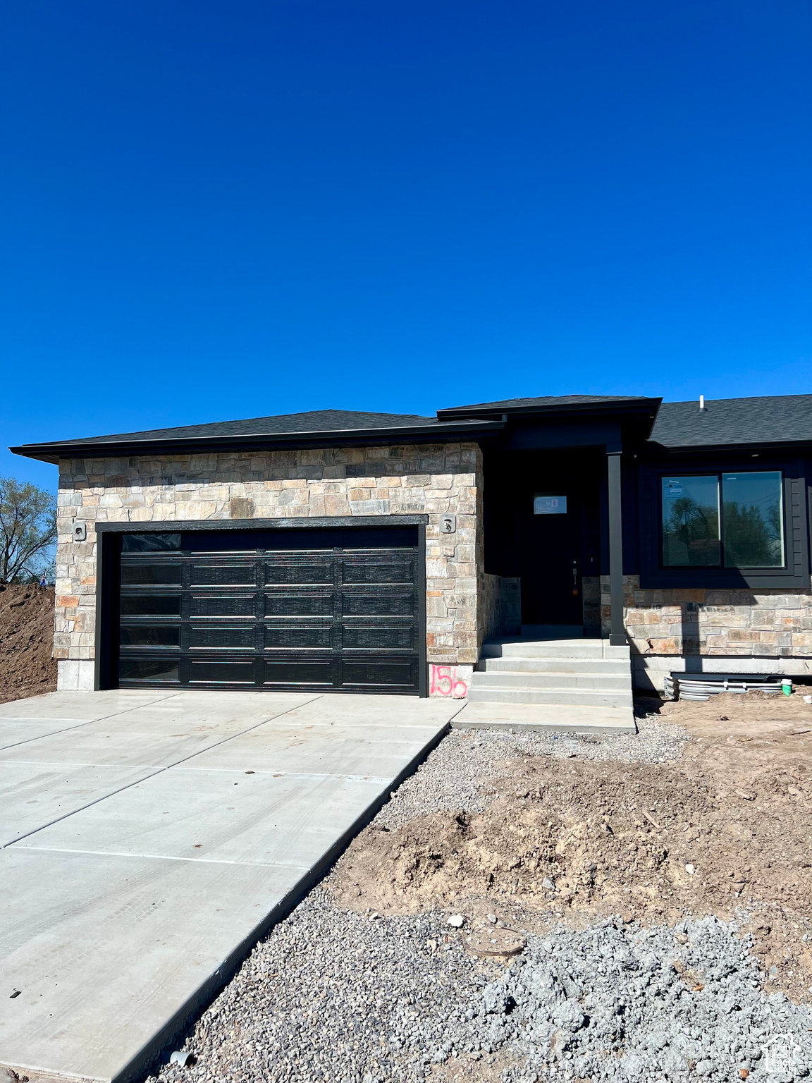 View of front of property featuring a garage