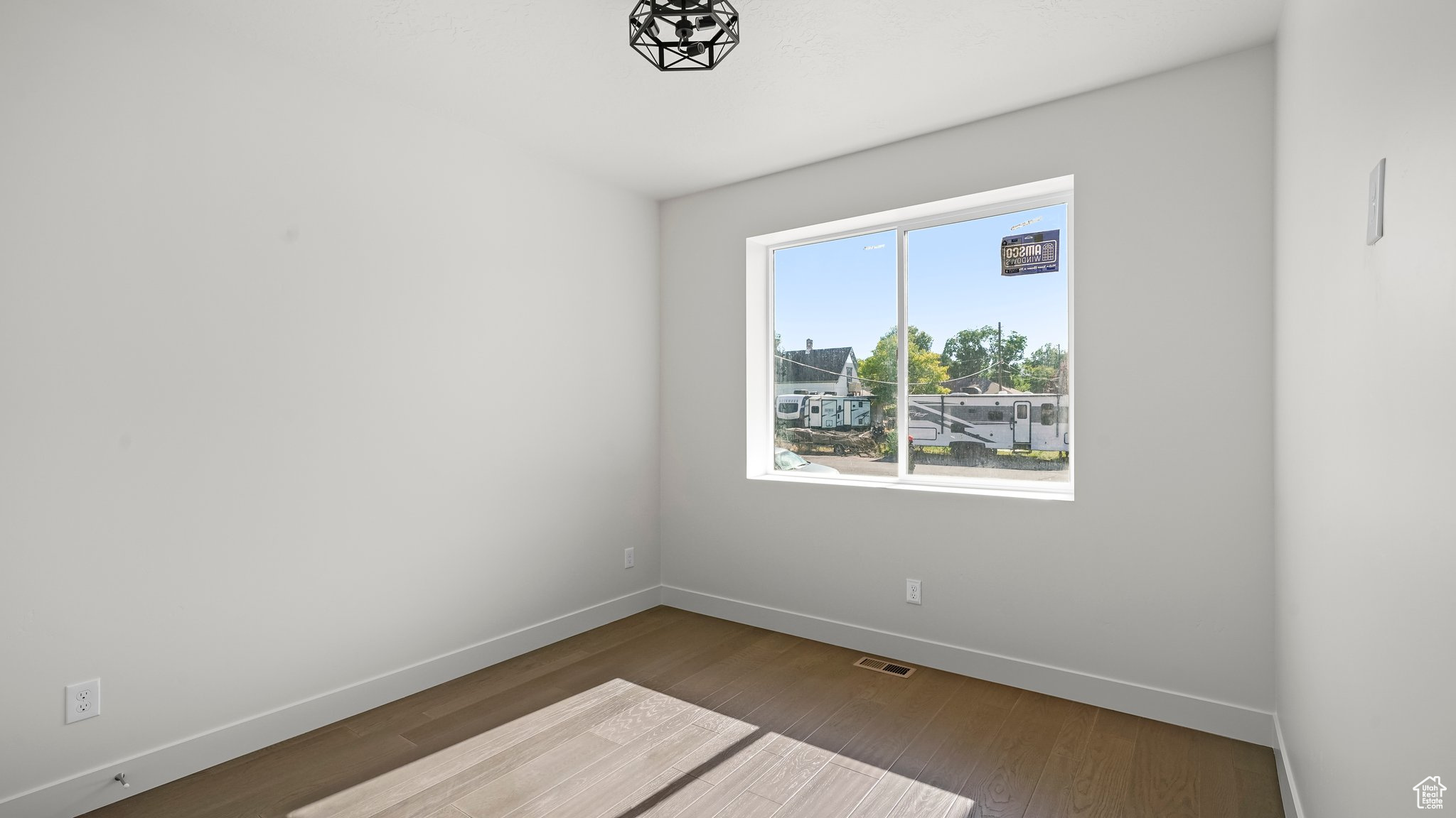 Spare room with hardwood / wood-style flooring