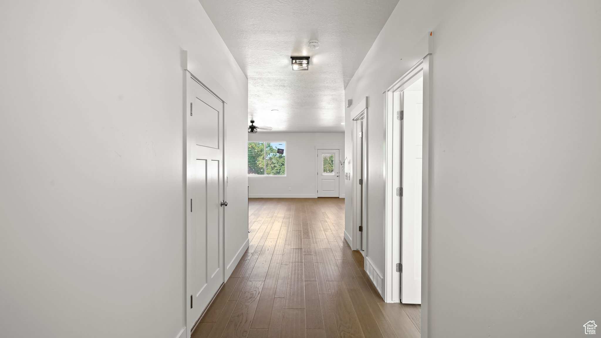 Corridor featuring hardwood / wood-style flooring