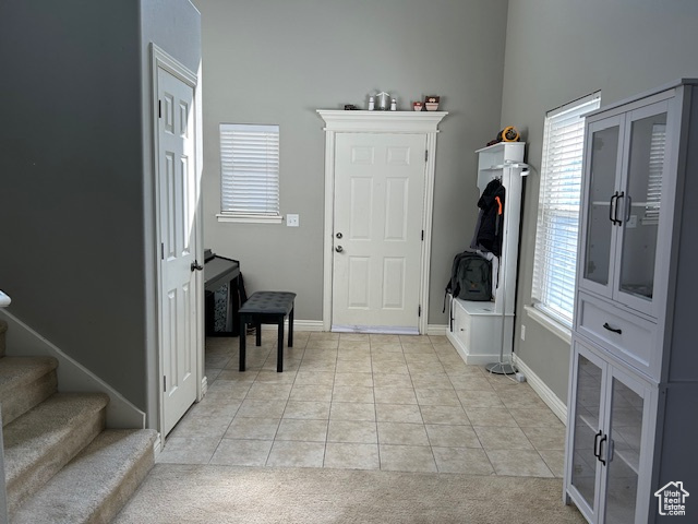 Entry way from Family Room featuring light tile flooring