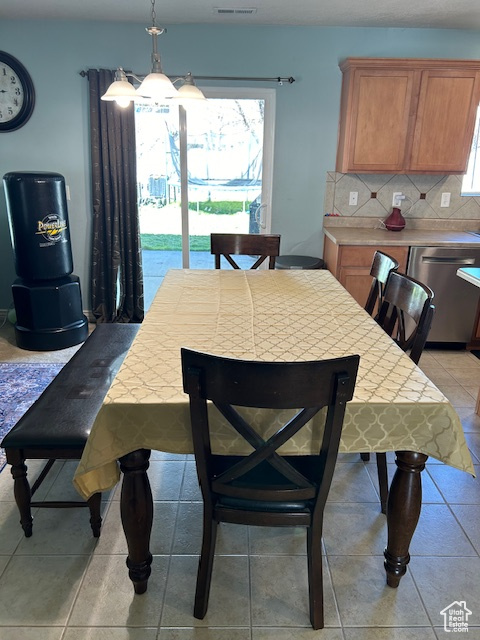 Dining room with light tile floors