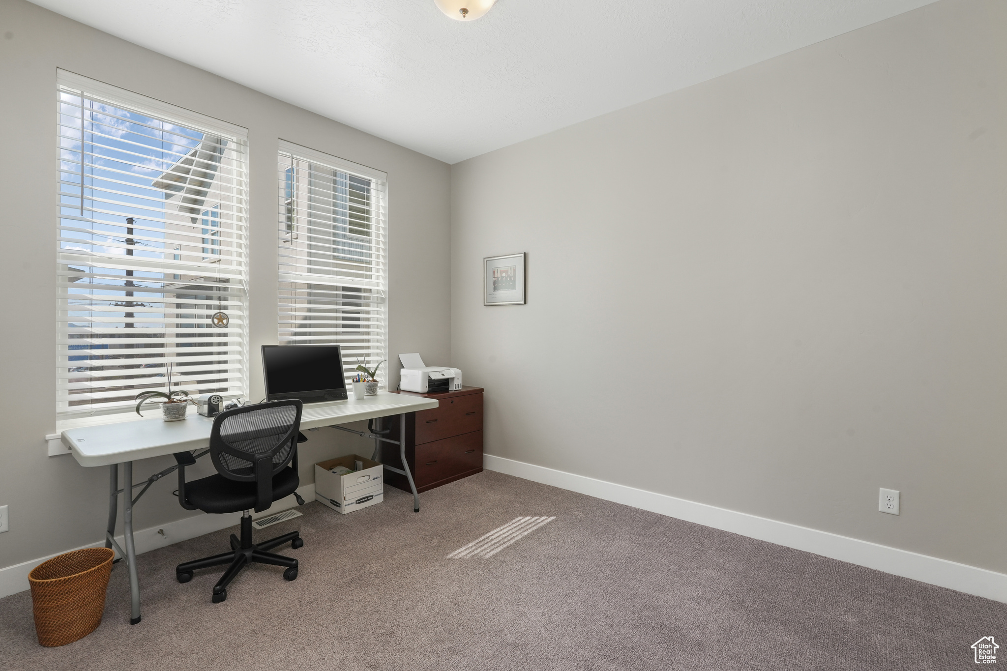 First Bedroom/office across from laundry room (second floor) with large windows
