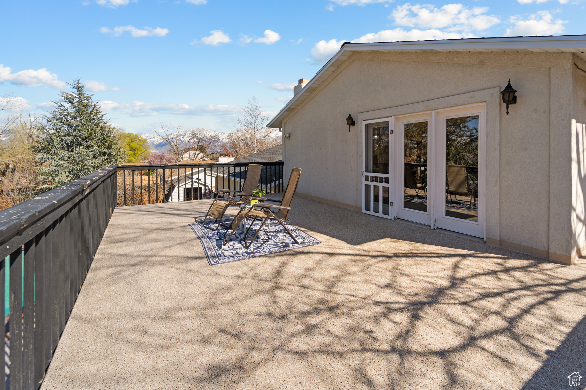 Primary Bedroom deck. Views of the beautiful mountains, park like back yard and pool.