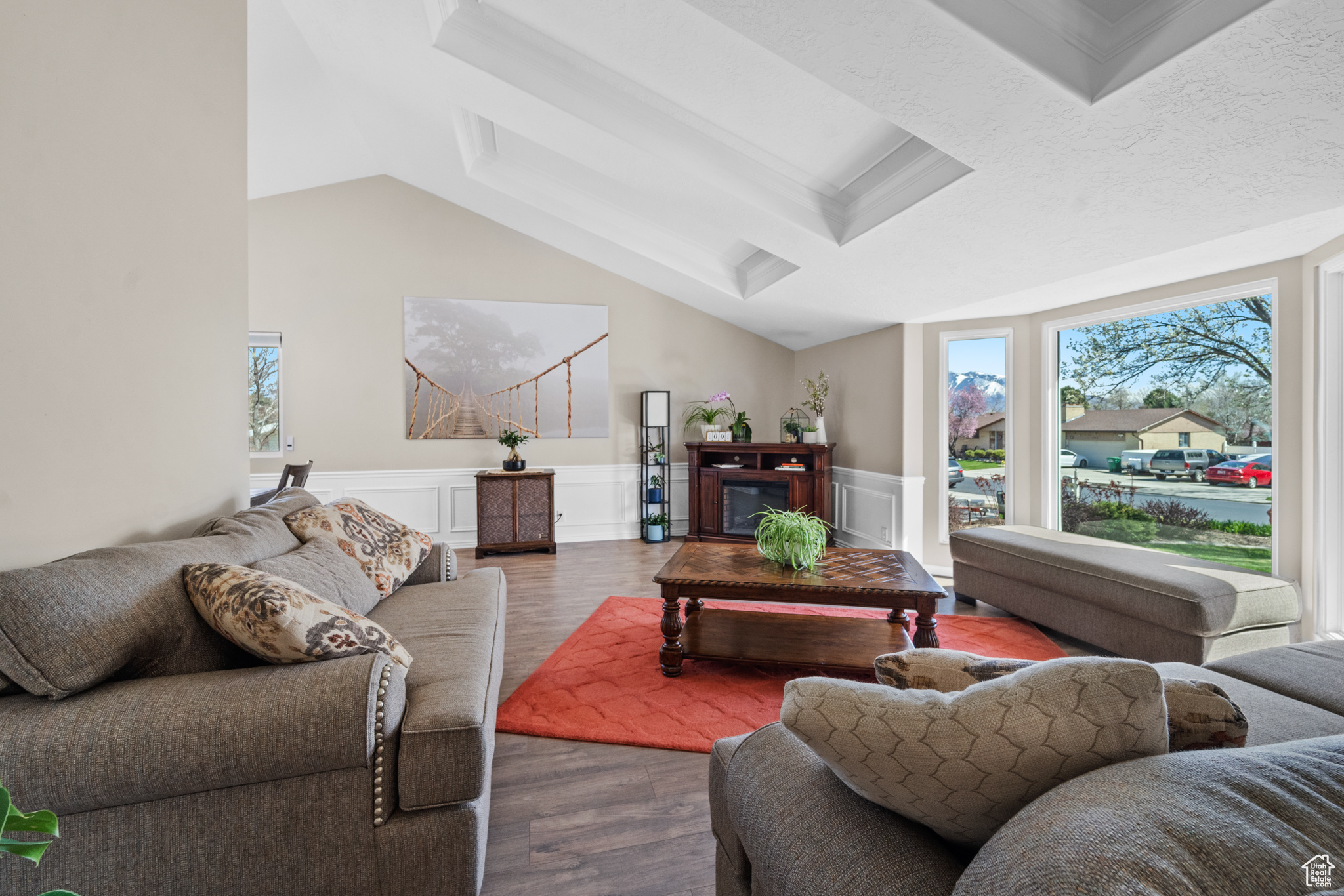 Living room featuring gorgeous ceilings and mill work!! Beautiful Mountain View from the huge bay window!