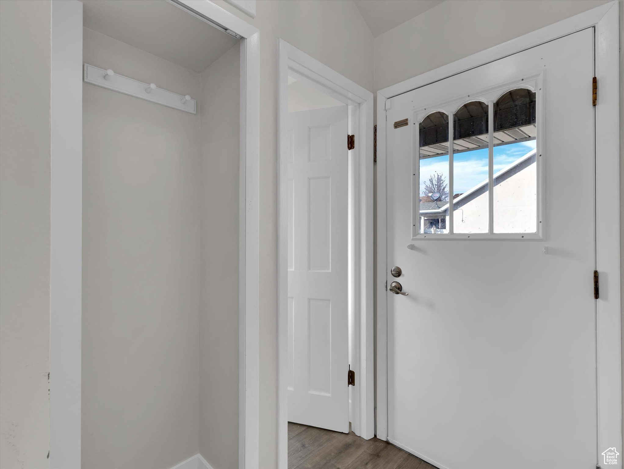 Doorway to outside featuring dark hardwood / wood-style floors