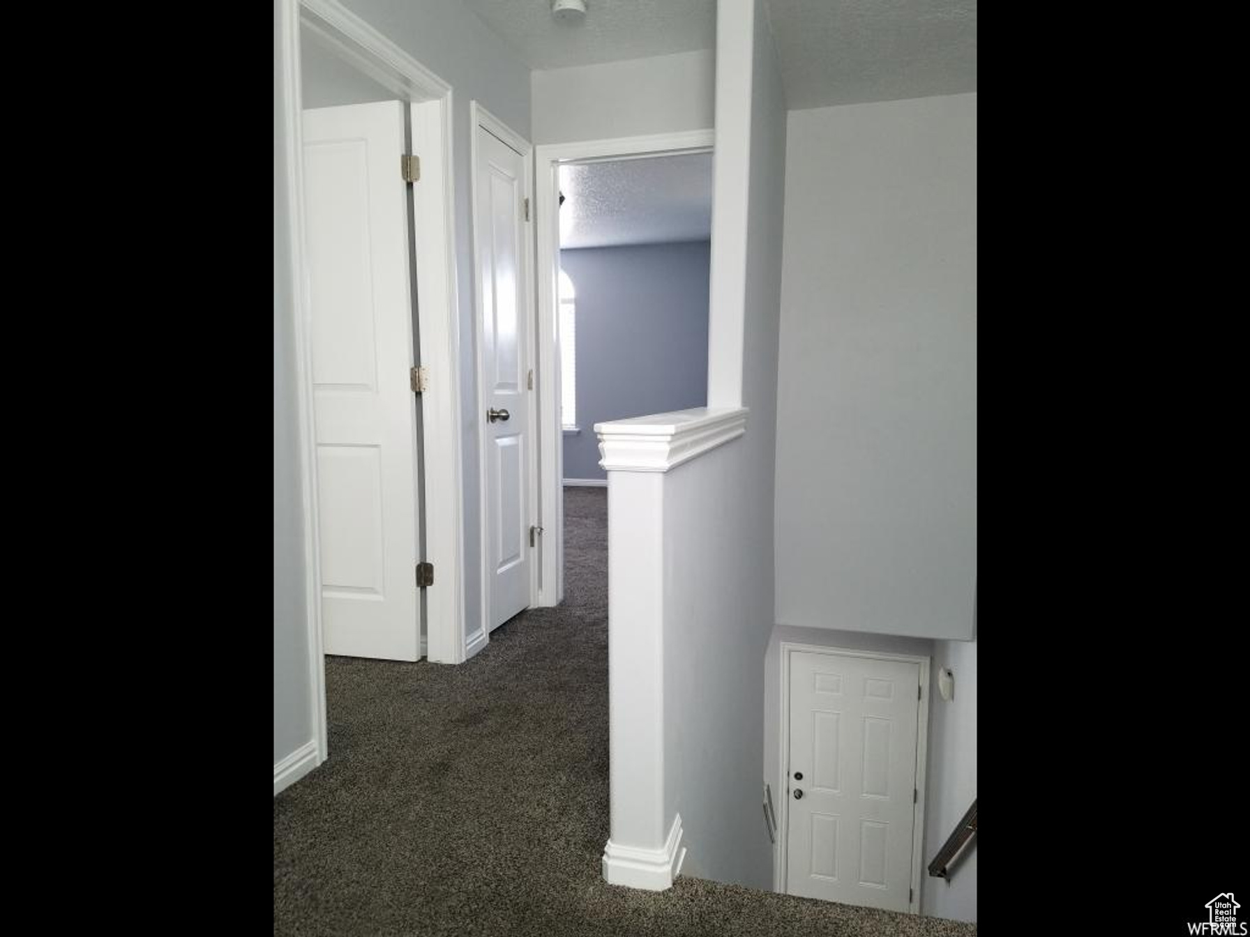 View of Upper Hallway, Stairs, Front Door, Guest Bedroom, Main Bedroom, & Linen Closet