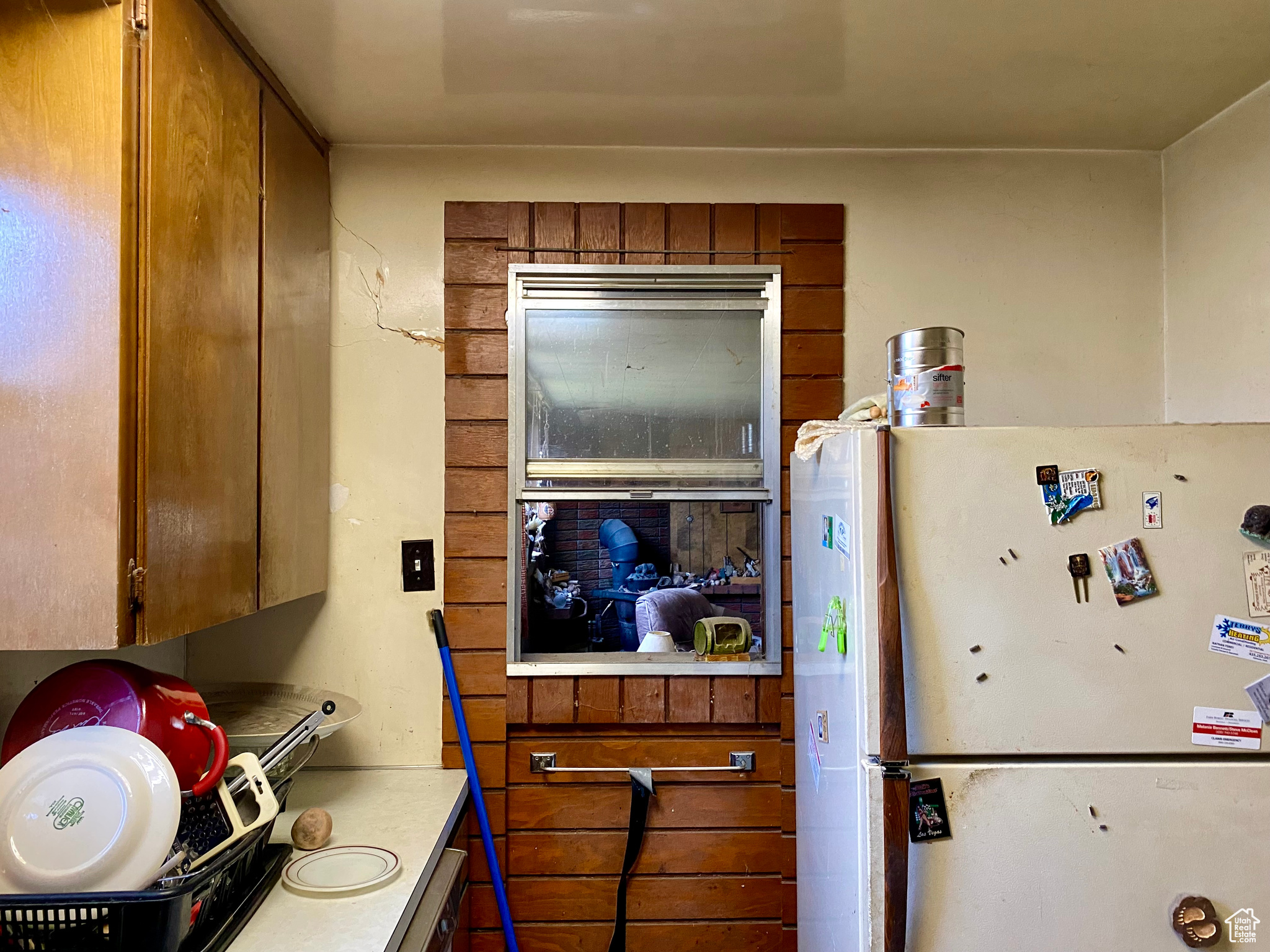 Interior space with white refrigerator