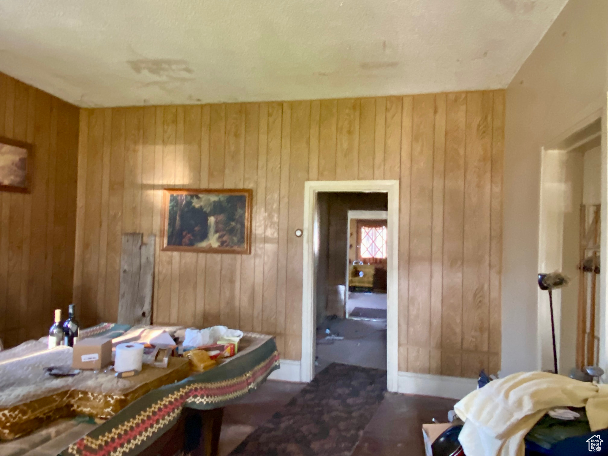 Bedroom featuring wood walls